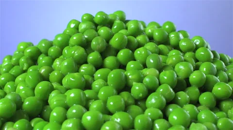 Peas isolated rotating on blue background Stock Footage 62392456