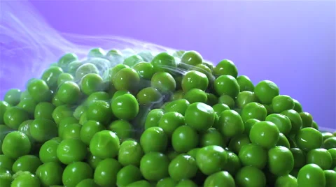 Peas isolated rotating on purple background with smoke Видео 62392261