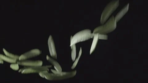 Peas soar in the air on a black background Stock Footage 146947681