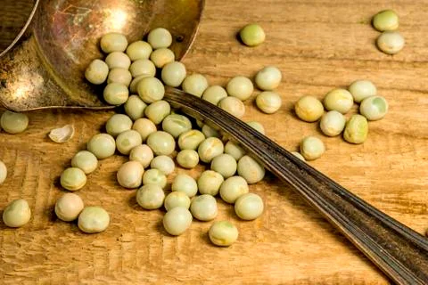 Peas with a spoon Stock Photos