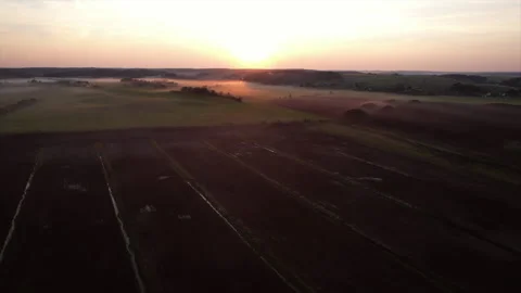 Peat extraction site in fog on sunset. Collecting peat on peatlands. Stock Footage 219825517