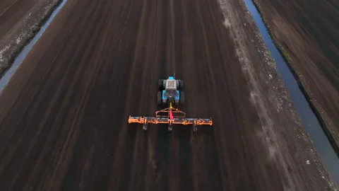 Peat Harvester Tractor on Collecting Extracting Peat. Видео 213337131