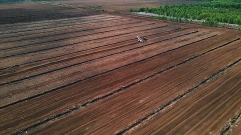 Peat Harvester Tractor working on Extracting Peat. Stock Footage 203919764