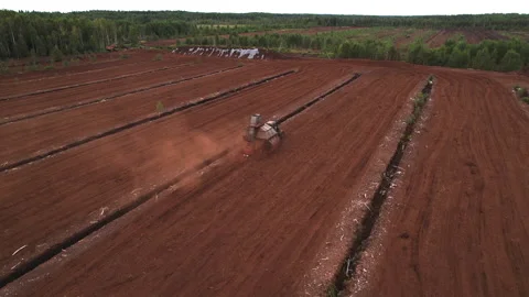 Peat Harvester Tractor working on Extracting Peat. Video stock 219824788