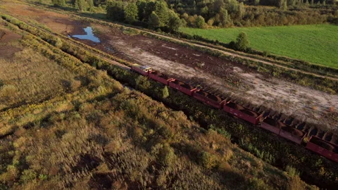 Peat transportation in freight wagons from peat extraction. Stock Footage 219824325