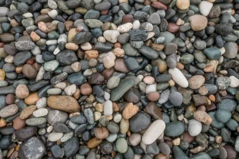 Pebble on beach abstract pattern texture background close-up shot Stock Photos
