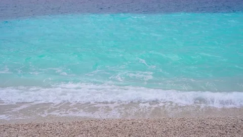 A pebble beach and clear azure sea water. Tourist destination - Antalya, Turk Stock Footage 169665663