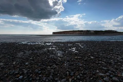 Pebble beach and Cliffs Stock Photos