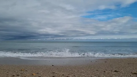 Pebble Beach and Distant Horizon 4K Stock Footage 318795317