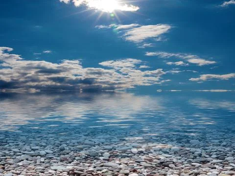 Pebble beach and sky 스톡 사진