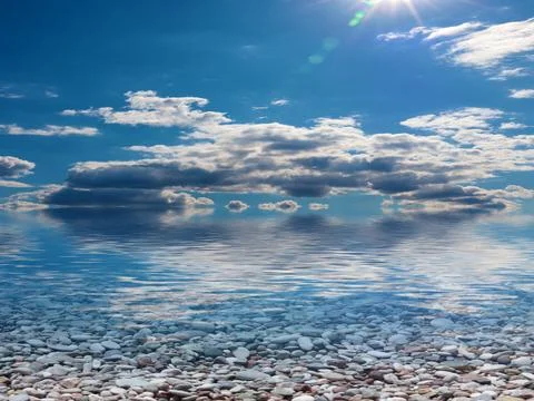 Pebble beach and sky 스톡 사진