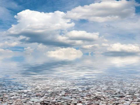 Pebble beach and sky 스톡 사진
