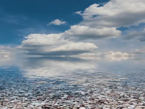 Pebble beach and sky 스톡 사진