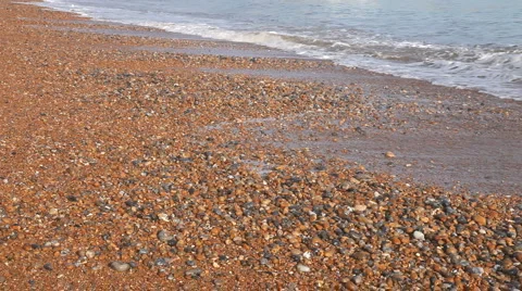 Pebble beach and small waves Stock Footage 941390