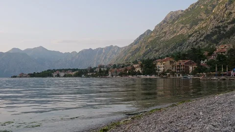Pebble beach and surf in the background of the city Stock Footage 90722304