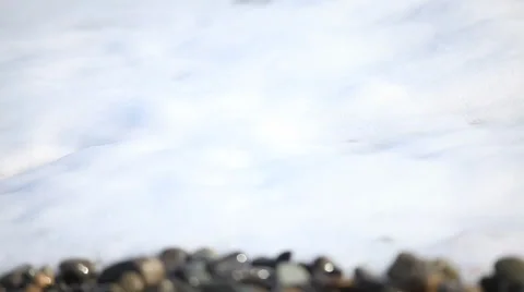 The pebble beach and wave Stock Footage 35801985