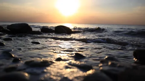 Pebble Beach and waves during amazing sunset. Have a sound of splashes Of waves Stock Footage 51832180