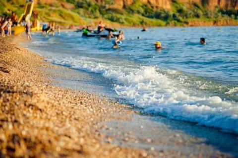 Pebble beach. Blurred focus. Concept of beach holidays, vacations Stock Photos