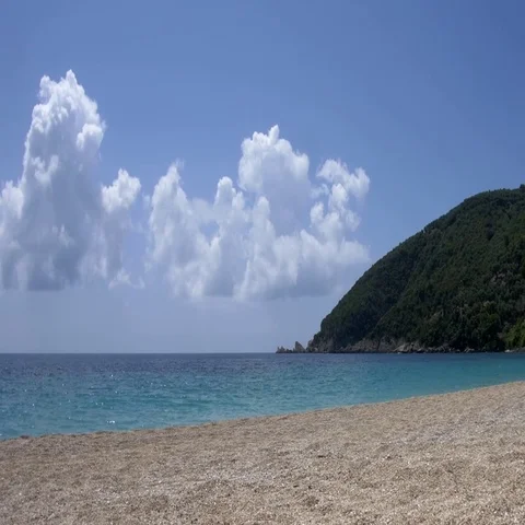 Pebble beach bordered by steep slopes and illuminated by the burning. Stock Footage 69322354