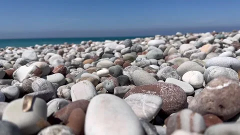 Pebble beach close up of pebbles Stock Footage 244916155