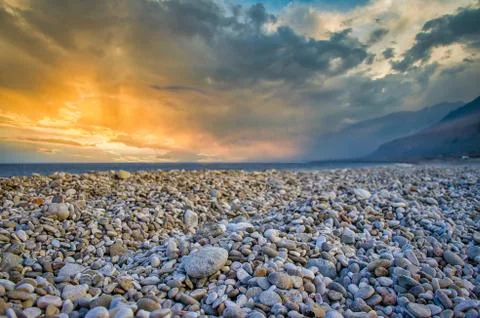 Pebble Beach During Sunset Stock Photos