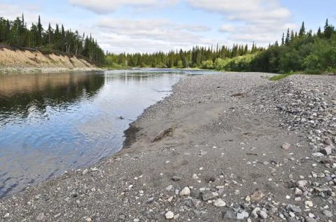 Pebble beach North of the river. Stock Photos
