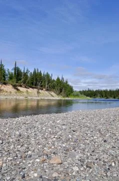 Pebble beach North of the river. Stock Photos