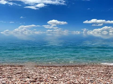 A pebble beach for relaxation Stock Photos