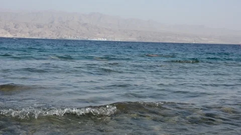 Pebble beach of the sea. the waves on the shore are slow. close up. 動画素材 96466779