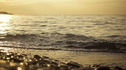 Pebble beach in the setting sun slow motion Stock Footage 81792737