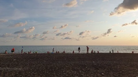 Pebble beach at sunset on the sea Stock Footage 116593530