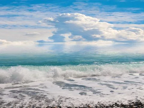 Pebble beach under a sky Stock Photos