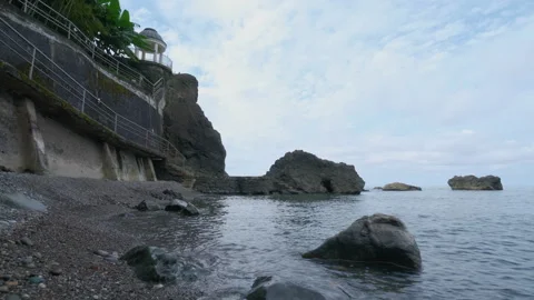 Pebble Beach View Looking Up at Cliffside Rotunda Video stock 347996284