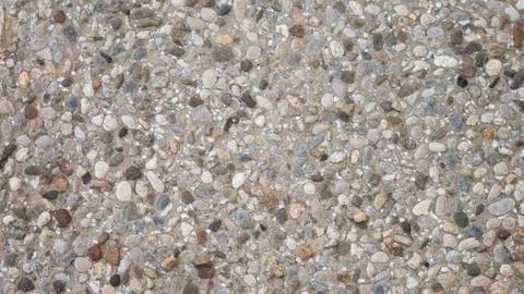 Pebble in concrete path. Top view stone background. Stock Photos