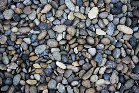 Pebble rocks texture pattern wallpaper Stock Photos