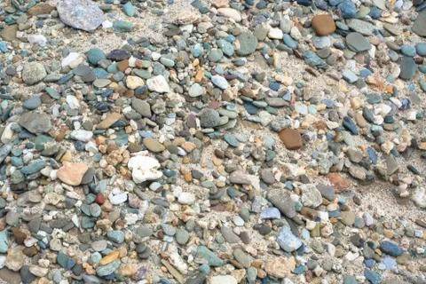 Pebble at the sand Stock-Fotos