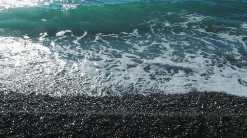 Pebble seashore on which the waves beat Stock Footage 157590761