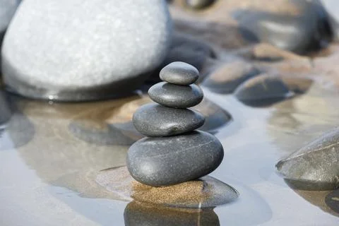 Pebble stack on the beach the stones represent balance and wellbeing of the m Stock Photos