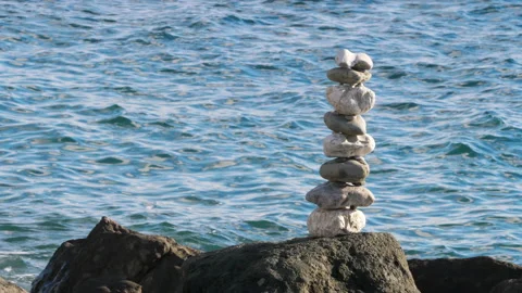 Pebble stack on a rock Stock Footage 144797077