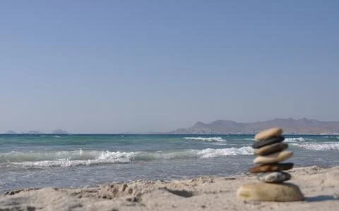 Pebble stack on a sandy beach Stock Photos