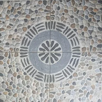 Pebble Stone Ceramic Tile With Circular Mandala Pattern Stock Photos