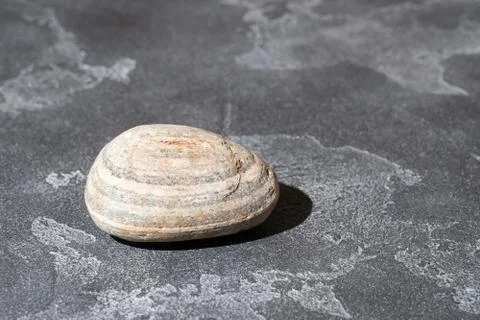 Pebble stone on the concrete surface. 스톡 사진