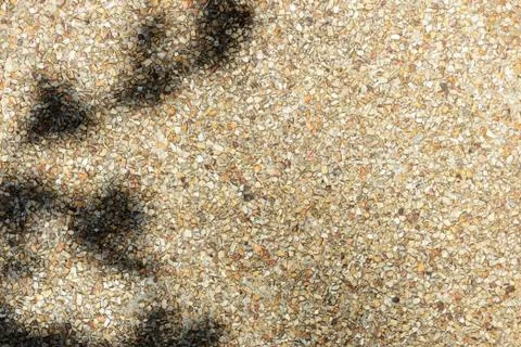 Pebble stone floor texture close up with shadow on it. Abstract background 스톡 사진