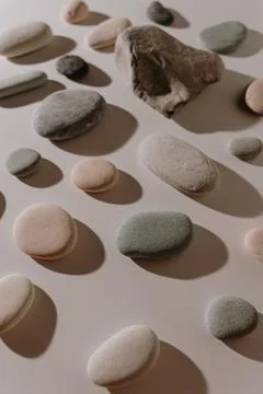 Pebble stone pattern on white background with warm white light Stock Photos