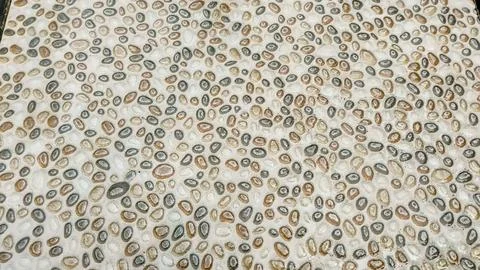 Pebble Stone Textured Floor Background with Circular Pattern Stock Photos