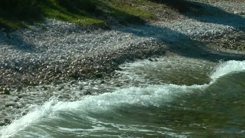 Pebble surf line with oncoming waves. Stock Footage 155068218