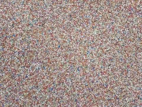 Pebble surface with many colors Stock Photos