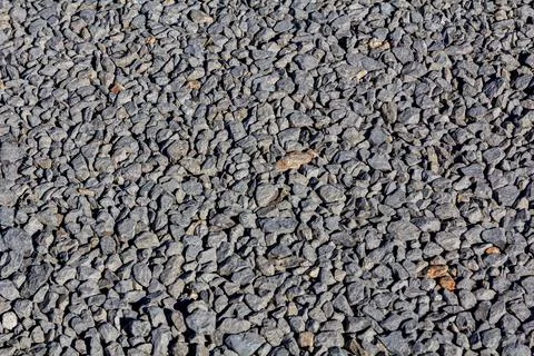 Pebble texture. Stone Road. The texture of the gravel road. Stock-Fotos