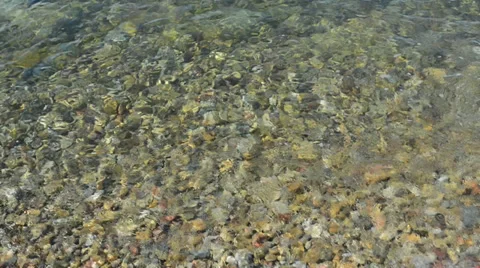 Pebble under clean water Stock Footage 34365877