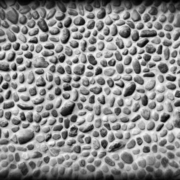 Pebble wall texture Stock Photos